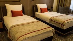 Letto o letti in una camera di Hotel Austria & Bosna