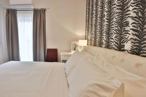 Postel nebo postele na pokoji v ubytování V Luxury Apartment 3
