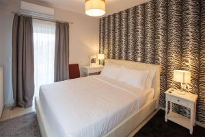 Postel nebo postele na pokoji v ubytování V Luxury Apartment 3
