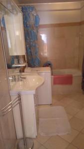 a bathroom with a sink and a bath tub at Chalet Migazzi in Cogolo