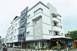 a white building with an address on it at Hotel 88 Jember By WH in Jember