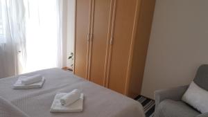 Uma cama ou camas num quarto em Apartma Sebastjan Dobova near Terme Paradiso