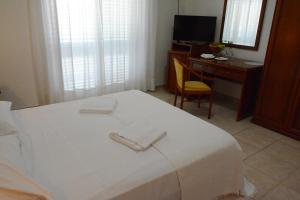 Postel nebo postele na pokoji v ubytování Castelvetere Hotel