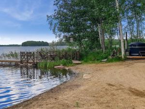 a campsite next to a body of water at Holiday Home Matruusin majakka by Interhome in Onkamo