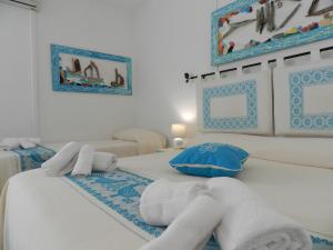 Postel nebo postele na pokoji v ubytování Hotel Canne al Vento