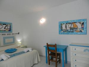 Postel nebo postele na pokoji v ubytování Hotel Canne al Vento
