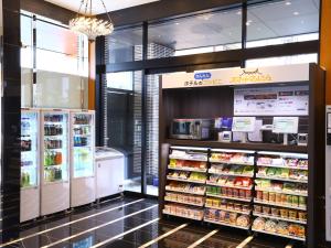 a grocery store aisle with a lot of food at APA Hotel Ayase Ekimae in Tokyo