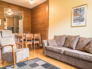 a living room with a couch and a table at Holiday Home Ylläs chalets a507 by Interhome in Ylläsjärvi