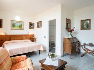 A bed or beds in a room at Villa La Rosa by Interhome