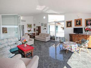 A seating area at Villa La Rosa by Interhome