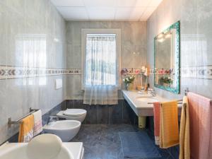 A bathroom at Villa La Rosa by Interhome