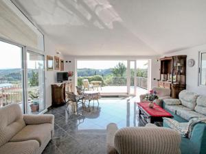 A seating area at Villa La Rosa by Interhome