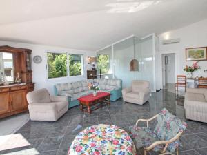 A seating area at Villa La Rosa by Interhome