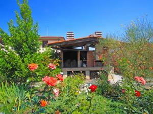 A garden outside Villa La Rosa by Interhome