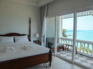a bedroom with a bed and a view of the ocean at Sichon Goodwill in Sichon +124 photos