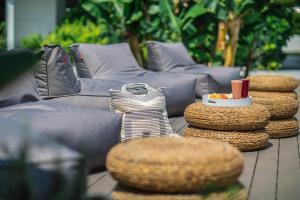 a group of couches and stools on a table at Nissi Park Hotel in Ayia Napa