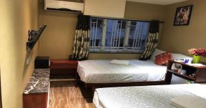 Voodi või voodid majutusasutuse Rich Hostel toas