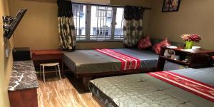 Voodi või voodid majutusasutuse Rich Hostel toas