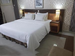 Rúm í herbergi á Citilodge Hotel