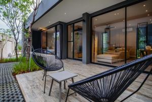 Posezení v ubytování The Woods Natural Park Resort Phuket