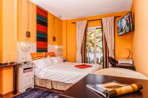 Postel nebo postele na pokoji v ubytování Boutique Hotel Pueblo