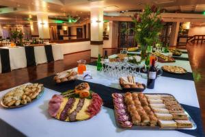 a table with many different types of food on it at Hotel de la Cañada in Córdoba