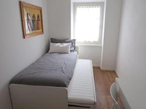 Кровать или кровати в номере Appartamento per vacanze "IL GELSO"