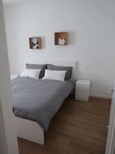 Кровать или кровати в номере Appartamento per vacanze "IL GELSO"