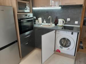 Kuchyň nebo kuchyňský kout v ubytování Apartment RELAX