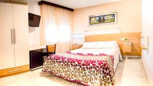 Postel nebo postele na pokoji v ubytování Hotel Albero