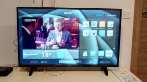 a flat screen tv sitting on top of a table at Bnap Masip in Oviedo