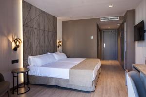 Łóżko lub łóżka w pokoju w obiekcie Hotel Bristol 4 Sup