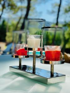 a three tiered tray with three different colored drinks at Zen et Chic in Ménerbes