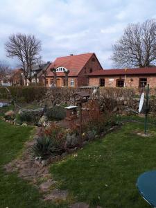 a house with a garden in front of a house at Haus Ebel in Putgarten