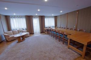 a conference room with a long table and chairs at KTU Rest House Politechnika in Palanga