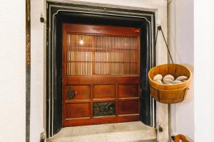 a door with a basket of eggs in front of it at 1組貸切りの宿 Thank you Hippo 2 -KURA 蔵- in Matsumoto