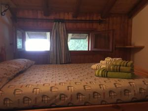 Postel nebo postele na pokoji v ubytování Agriturismo Luloc