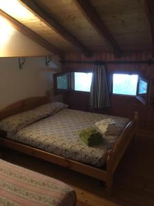 Postel nebo postele na pokoji v ubytování Agriturismo Luloc