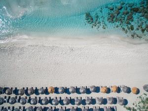an aerial view of a beach with rocks and the ocean at Nissi Beach Resort in Ayia Napa