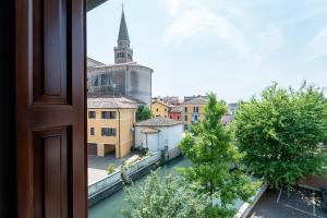 a view from a window of a city with a church at Hotel Spessotto in Portogruaro