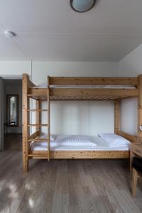 a bedroom with two bunk beds in a room at Guesthouse Brekka in Brekka