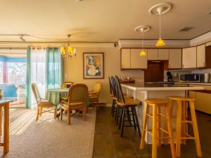 a kitchen and dining room with a table and chairs at Shaker Mill Inn in West Stockbridge