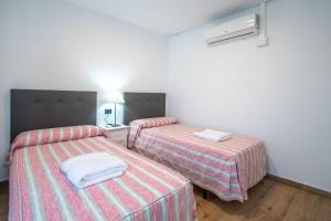 Posteľ alebo postele v izbe v ubytovaní Apartamento Albatro´s suite