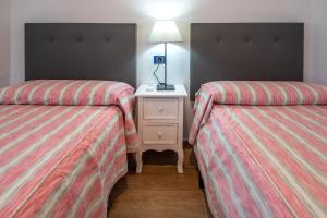 Posteľ alebo postele v izbe v ubytovaní Apartamento Albatro´s suite