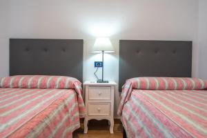 Posteľ alebo postele v izbe v ubytovaní Apartamento Albatro´s suite
