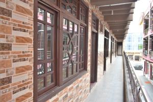 an empty hallway of a building with windows at Zara Residence 1 in Swat