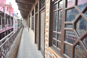 an empty alley in a building with windows at Zara Residence 1 in Swat