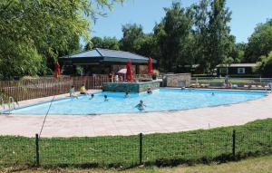 a group of people swimming in a swimming pool at Chalet Belvedere in Lanaken in Lanaken
