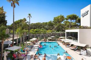a group of people in a pool at a resort at Hotel Paradiso Garden in Playa de Palma