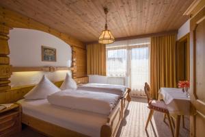 Postel nebo postele na pokoji v ubytování Gästehaus Rauch